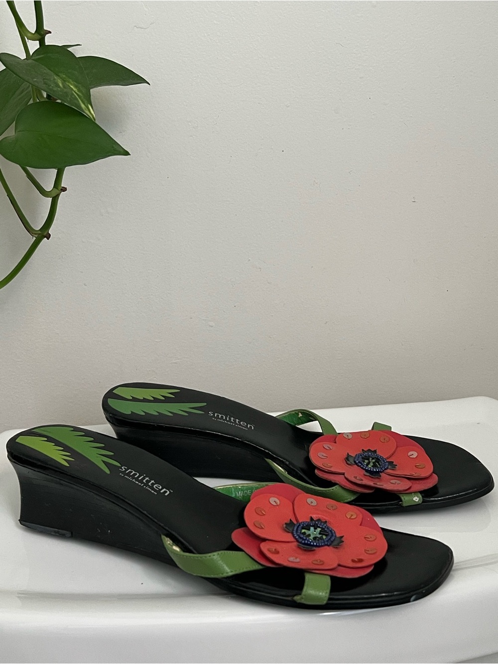 smitten Black Wedge Sandals with Red Floral Accent
